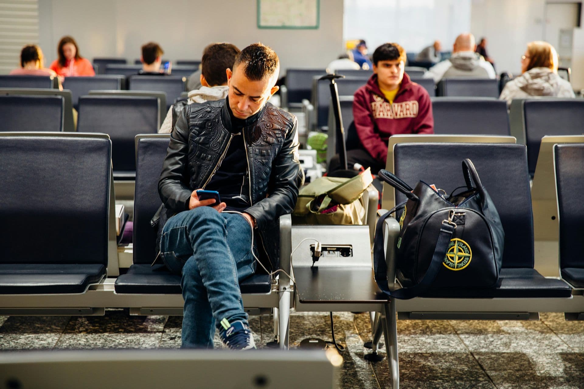 Traveller checking the mobile site at the gate
